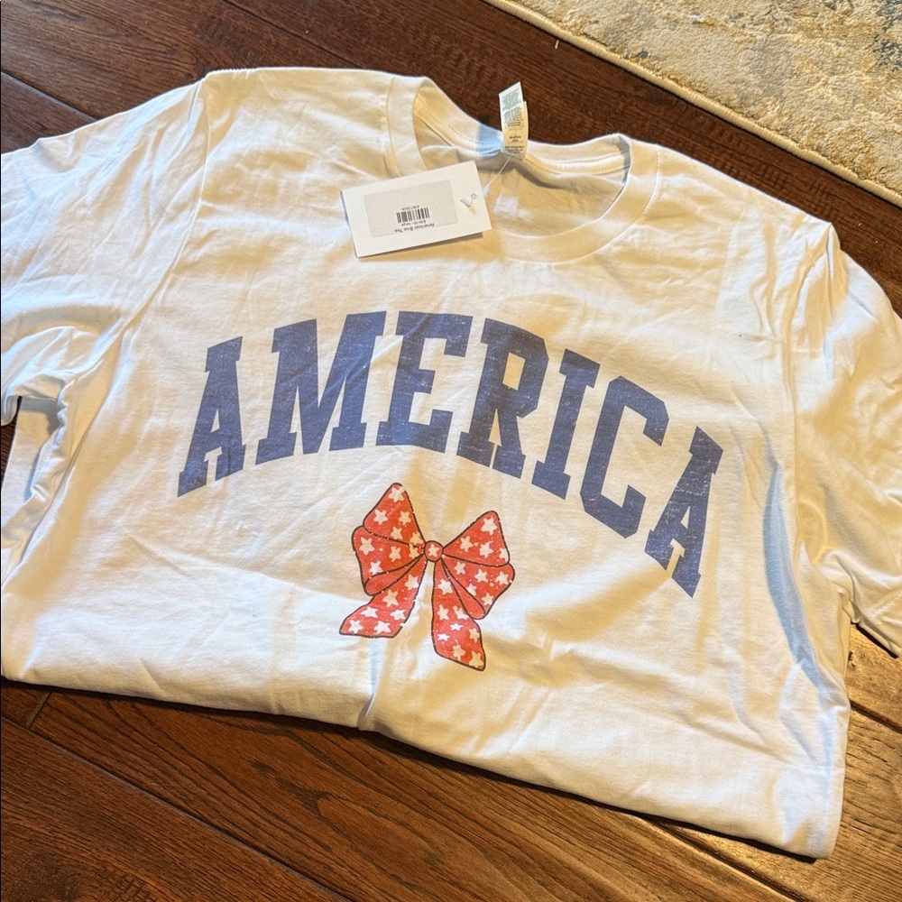 Bella Canvas White Tee with Blue 'America' and Red Bow